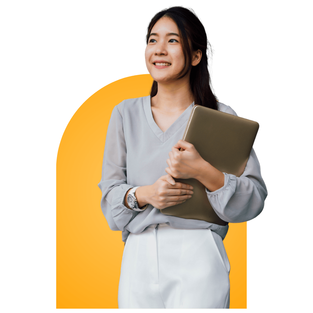 A young woman in a light gray blouse and white pants smiles while holding a closed laptop, standing in front of a yellow arch-shaped background—perfectly capturing the professionalism of a top SALES REPRESENTATIVE ASSISTANT.
